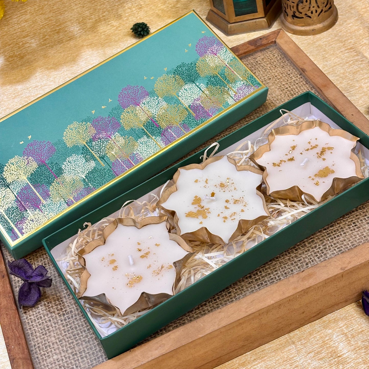 Premium decorative candle gift set for Diwali hosting, festive hampers, corporate gifts and luxury celebrations by ATLA.
Elegant teal gift box containing three decorative lotus candles, a luxury gifting choice for corporate Diwali celebrations.