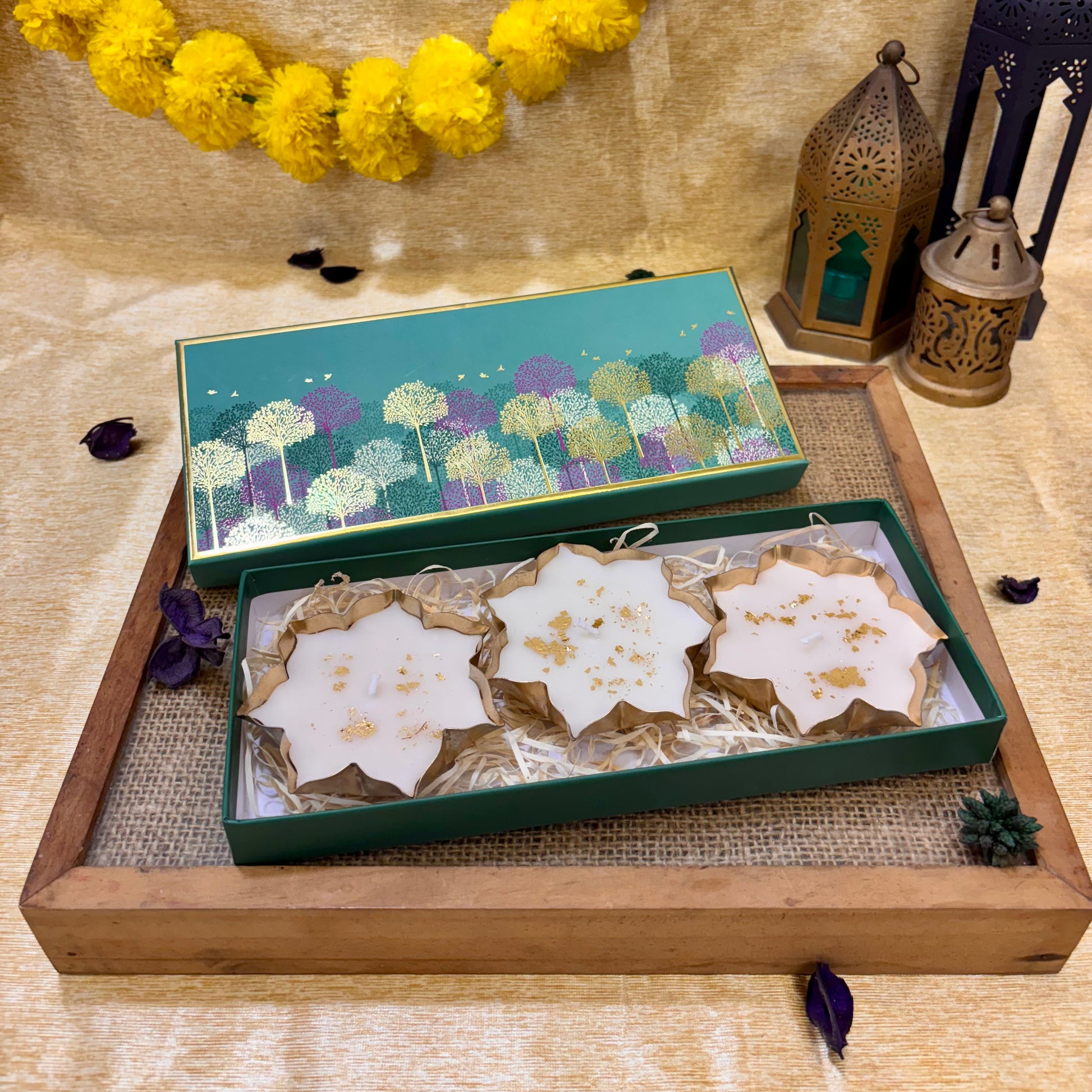 ATLA luxury candle gift set with vanilla fragrance and lotus-inspired design for Diwali décor and festive home styling.
Luxury decorative lotus candles in a teal gift box, a thoughtful festive gifting option for Diwali parties and celebrations.